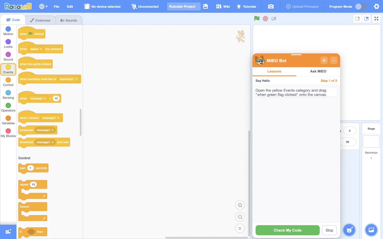 MIEO Bot on step 1 of the Say Hello lesson, with the Events category and the “when green flag clicked” block glowing