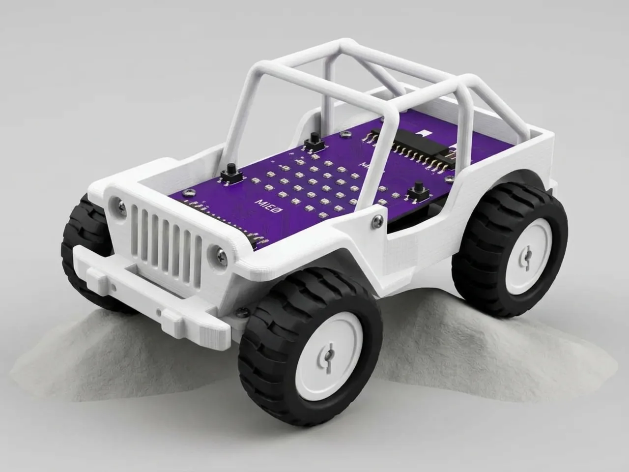 Four-wheel MIEO jeep with white printed body panels on a desk