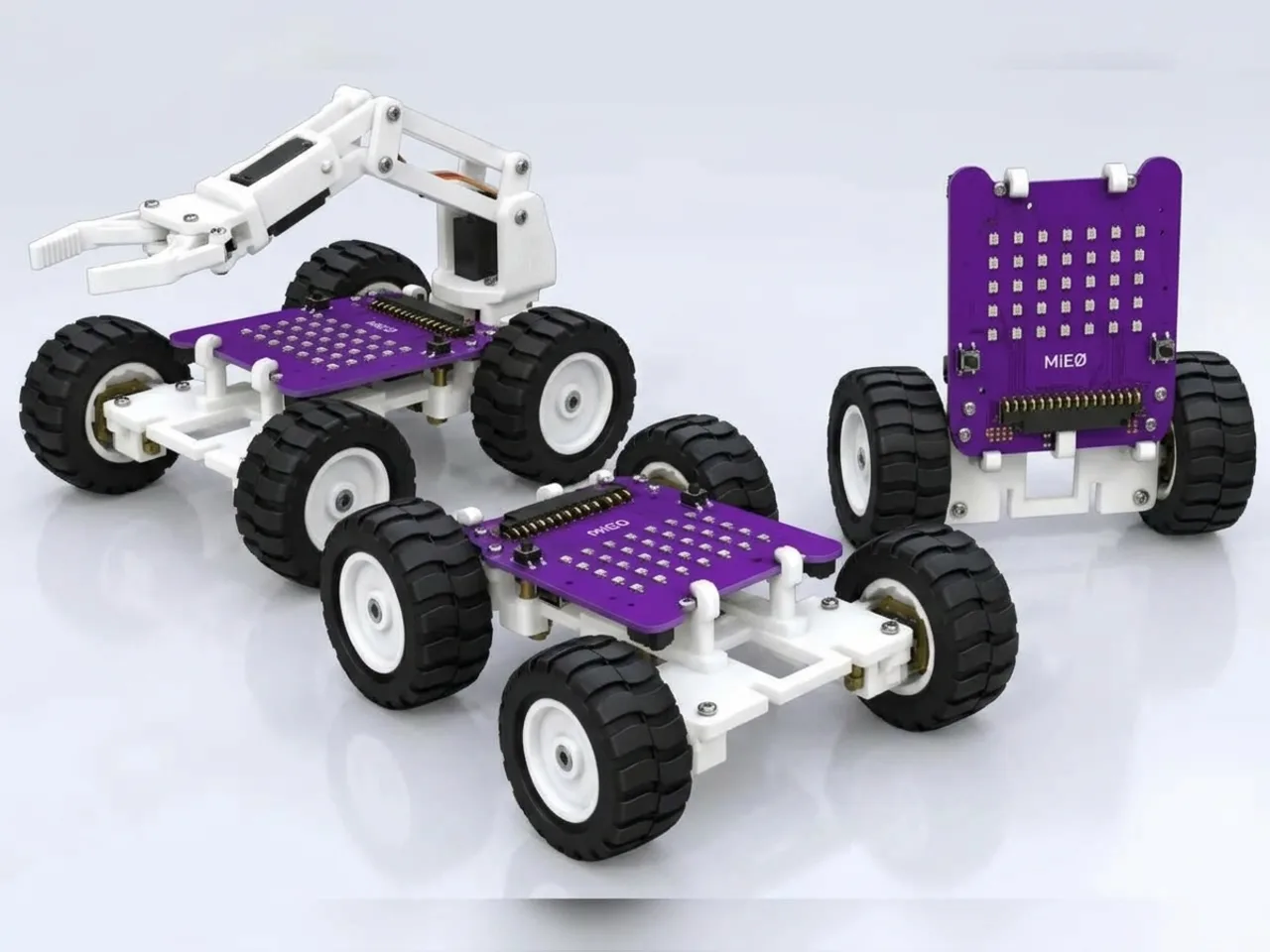Several MIEO Pro builds side by side: a rover, a gripper arm and an upright robot