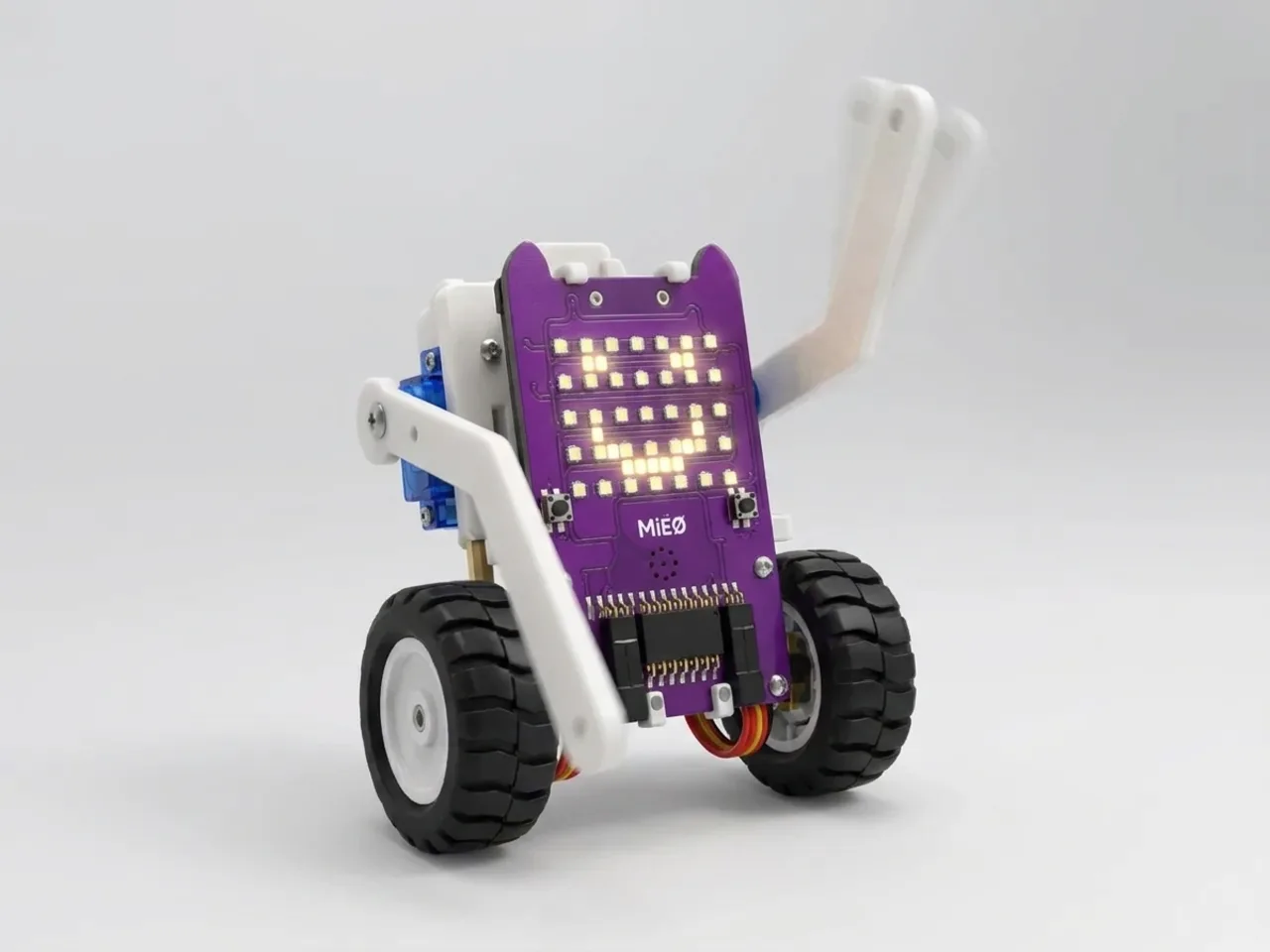 Upright MIEO waving a white printed arm on a servo
